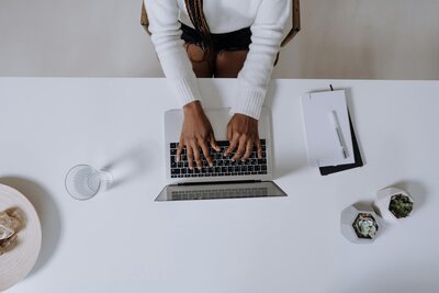 Woman typing on the computer