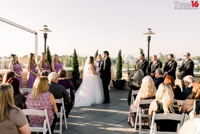Bride and Groom take their vows at The FIFTH Rooftop Restaurant in Anaheim