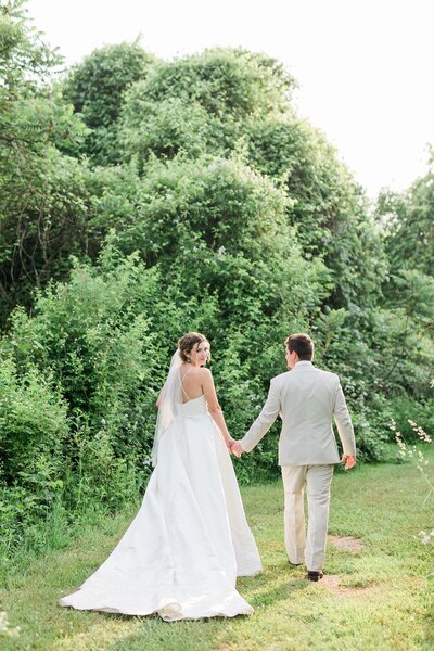 Just married couple strolling through garden