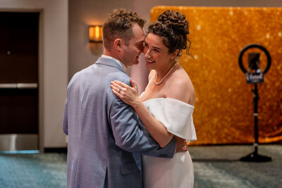 Bride and groom sharing first dance under warm lighting – photographed by wedding photographer Niko Coric – Lumen Clarity Media