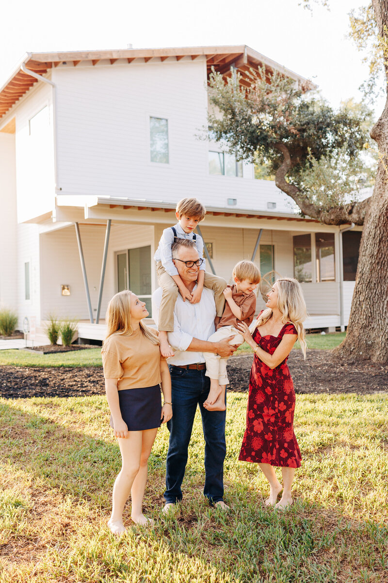 family outside their home taken by a Houston family photographer