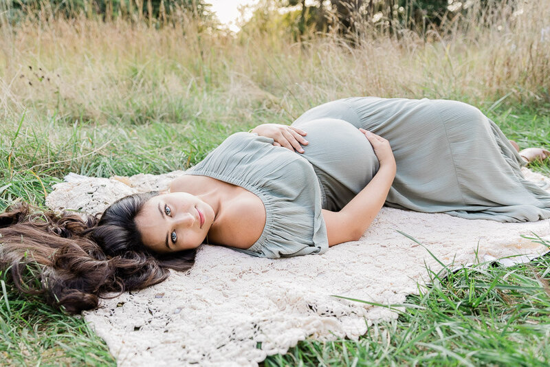 Bernardsville Maternity Photo of woman laying in grass