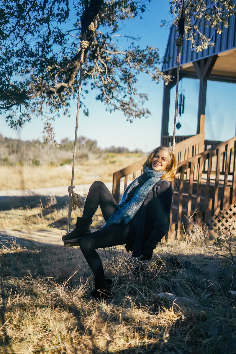 Woman sitting outside a cabin