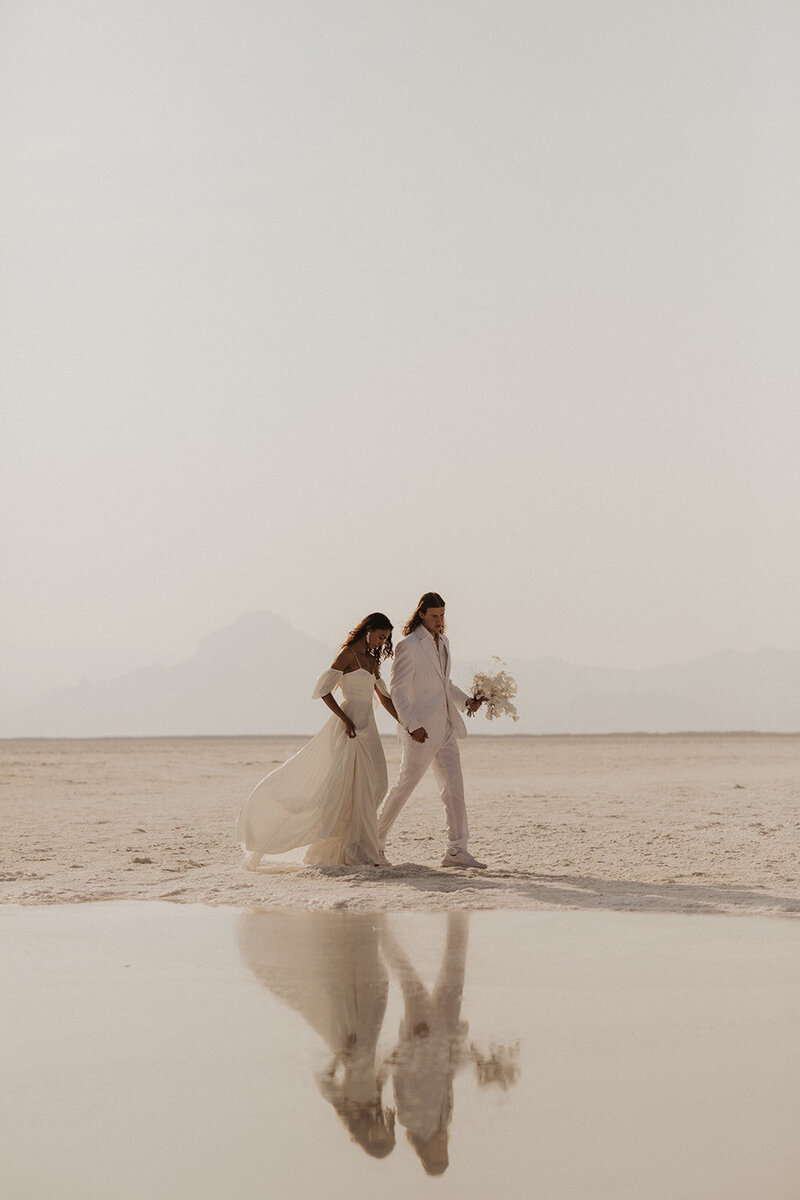 Desert wedding photoshoot, couple walking