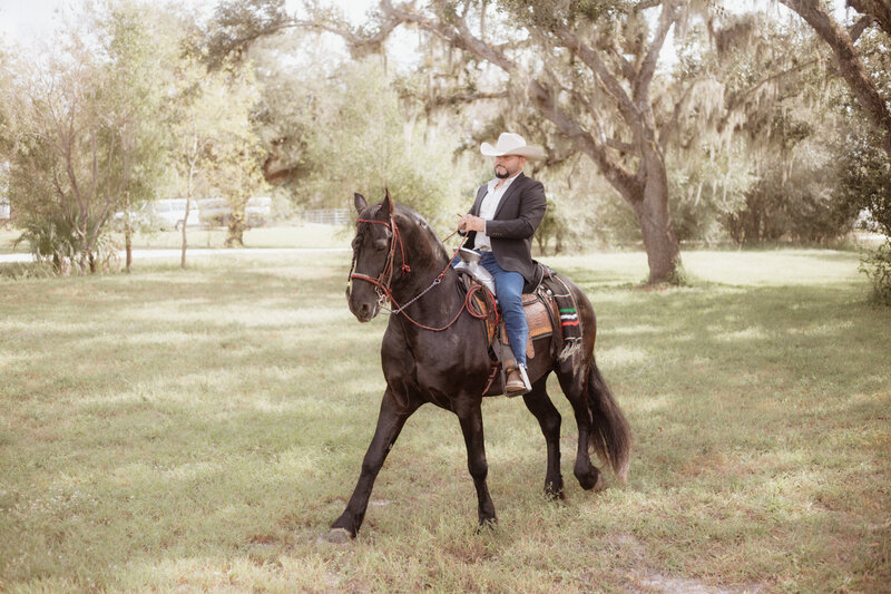 This image is of a groom riding his horse.