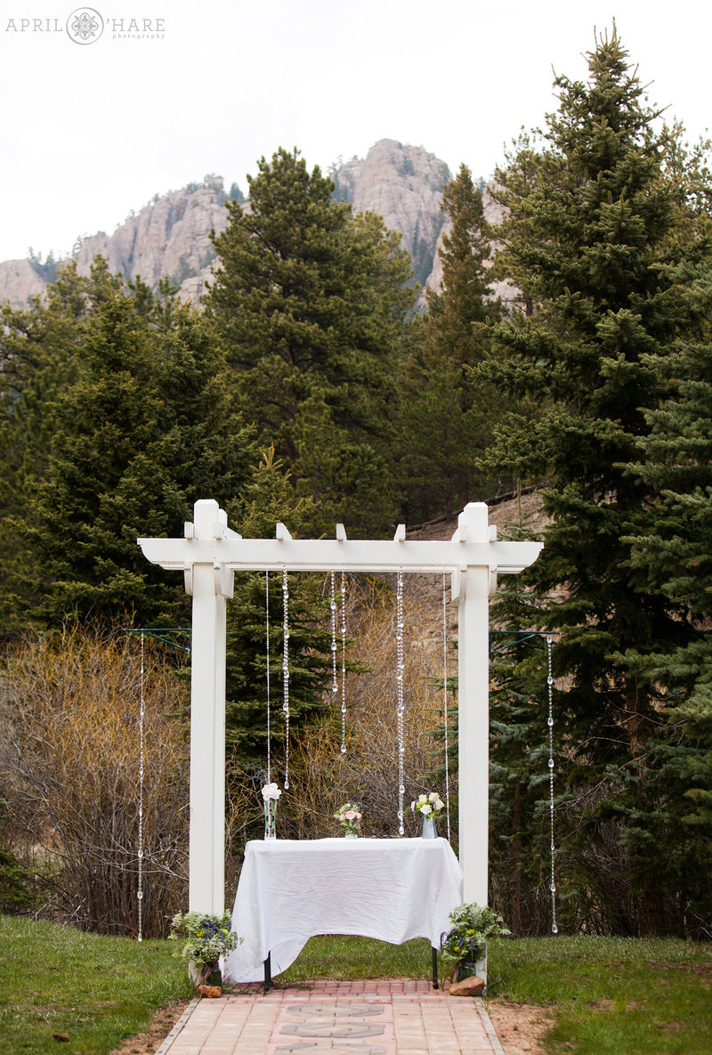 Table decor set up at Mountain View Ranch Wedding Ceremony in a mountain field