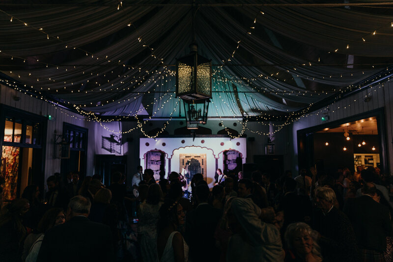 Tented wedding at night with lights