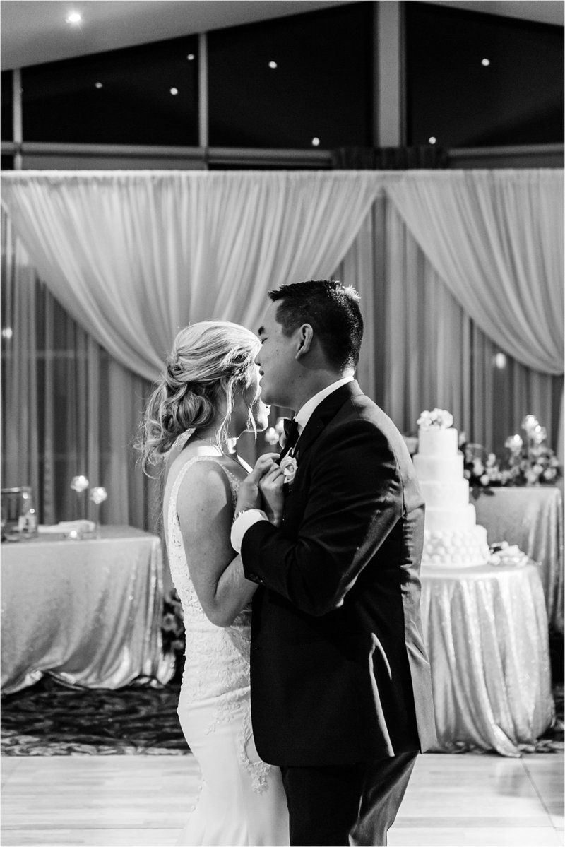 Groom sings softly to his bride during their first dance at Lionhead Golf Club in Oakville