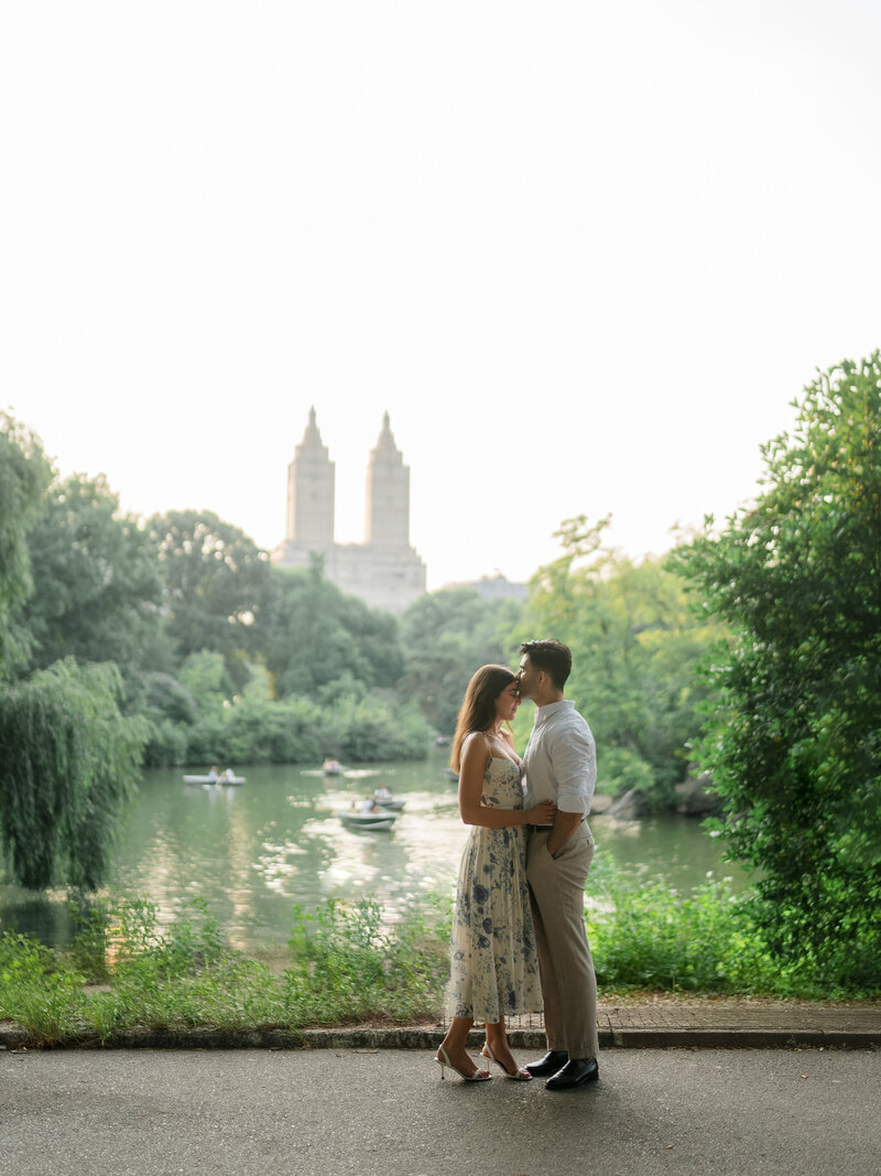 Bride and groom smiling at one another in city photographed by Chicago and destination editorial wedding photographer Arielle Peters