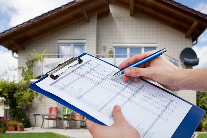 Checklist for home inspector showing a man making a check mark at home inspection in fort myers florida