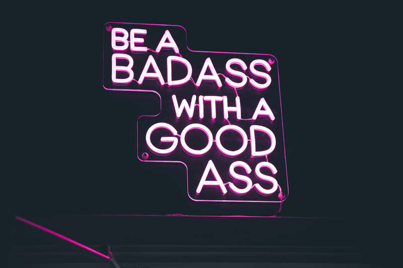 be a badass with a good ass pink neon sign