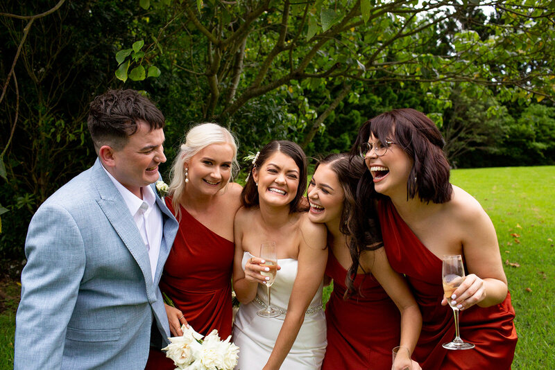 Bridesmaids and Bride laughing together