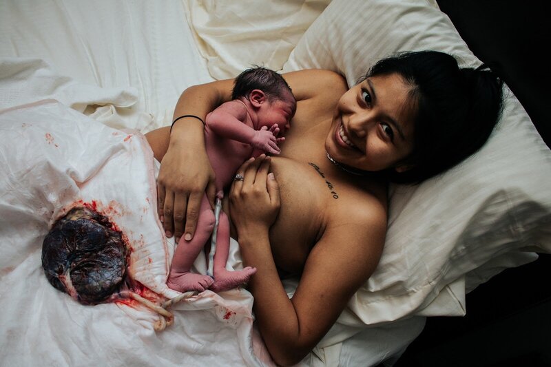 Mother postpartum with placenta