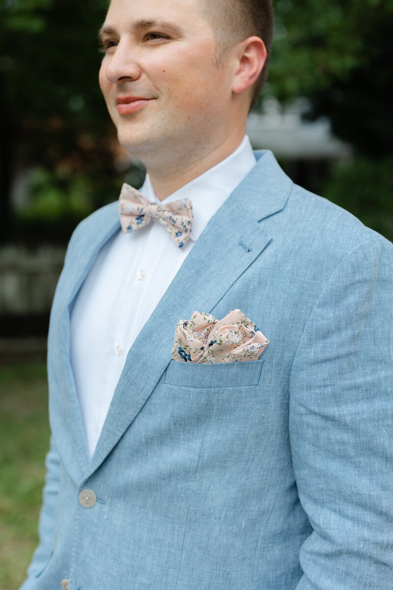 close up image of grooms bowtie and pocket square
