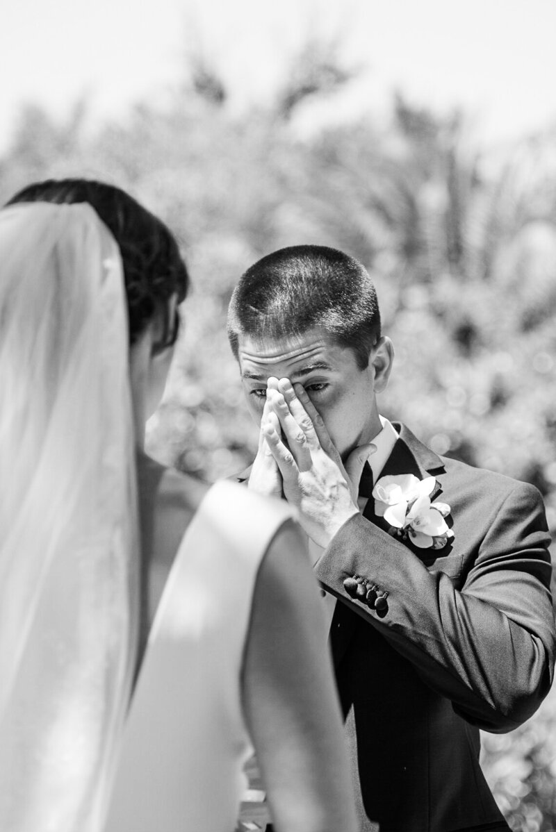 Point of View of the bride facing the groom who is crying overwhelmed by emotions during ceremony