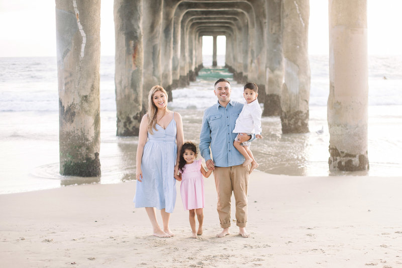 Family of 4 under the pier