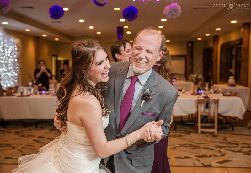 Bride dances with her dad at her Lodge at Breckenridge wedding reception in the Mountain View Conference Room