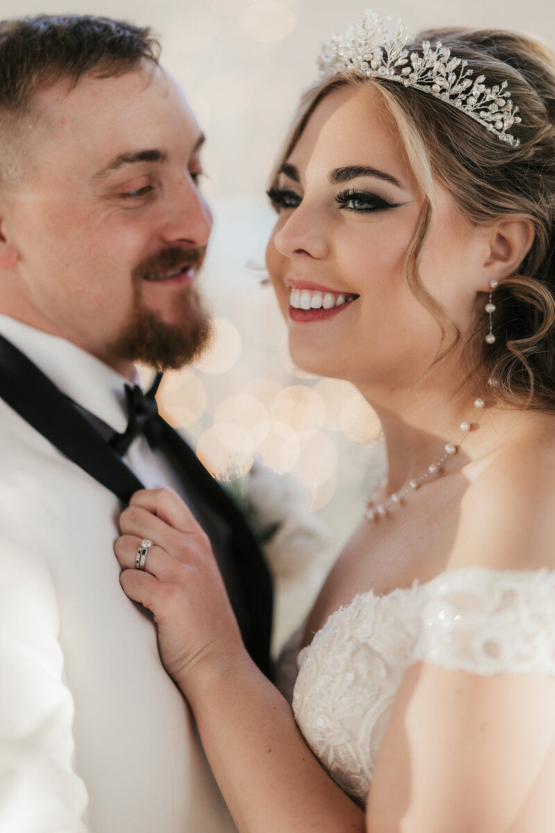 bride and groom smiling together