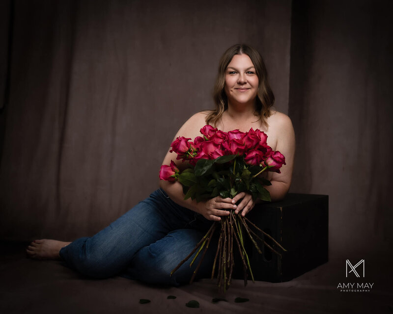 A stunning portrait of a survivors holding roses