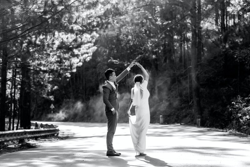 Wedding picture with couple dancing under trees in Colorado