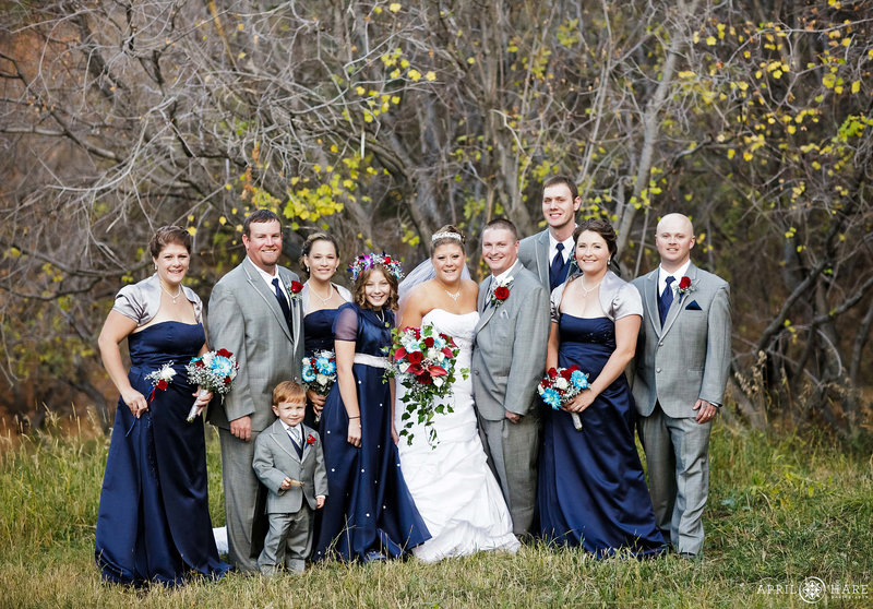 Wedding party portrait in late fall with just a little bit of color left at Pines at Genesee