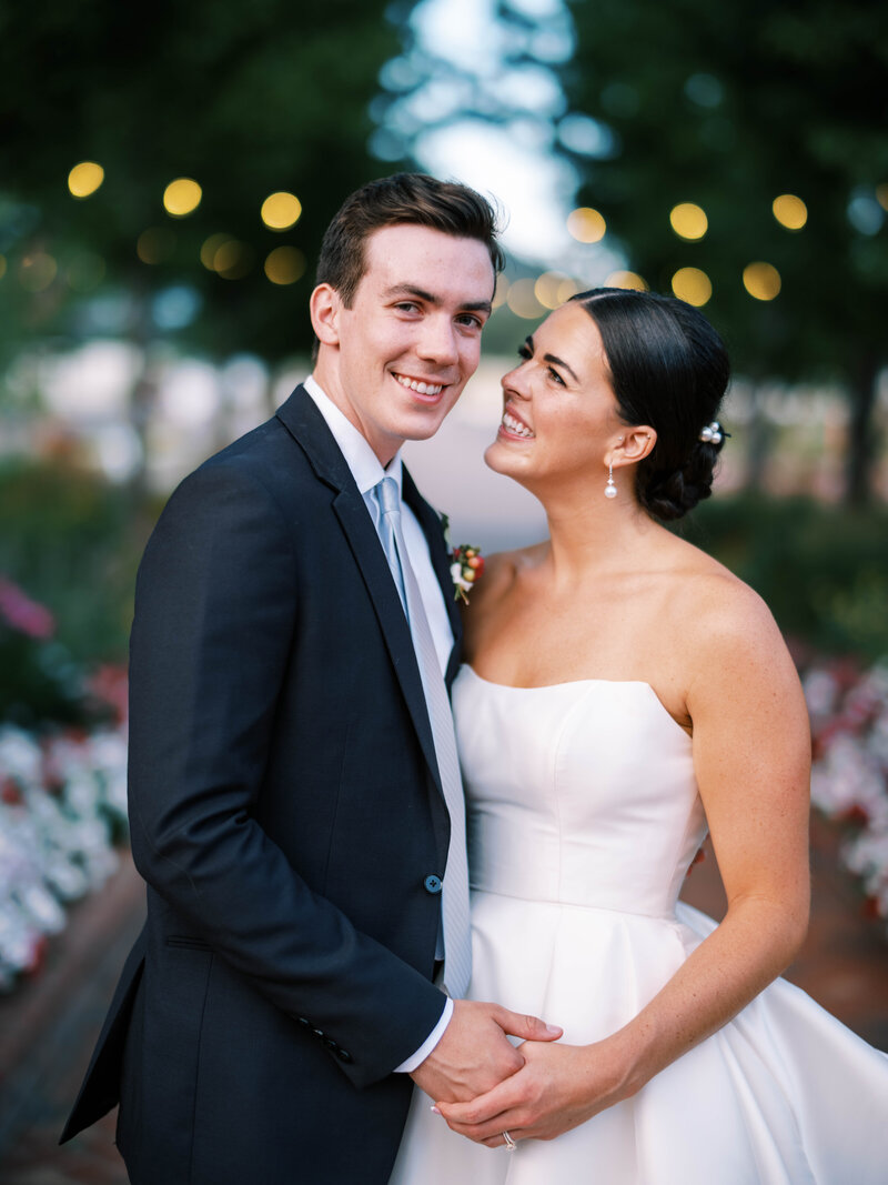 Bride and groom holding hands at Lafayette Park  outside by Colorado wedding Photographer JKG Photography