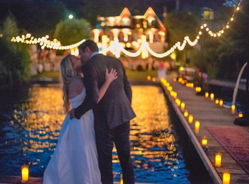 Emily John Wedding - Closer Kiss on Dock at Night House with Lights