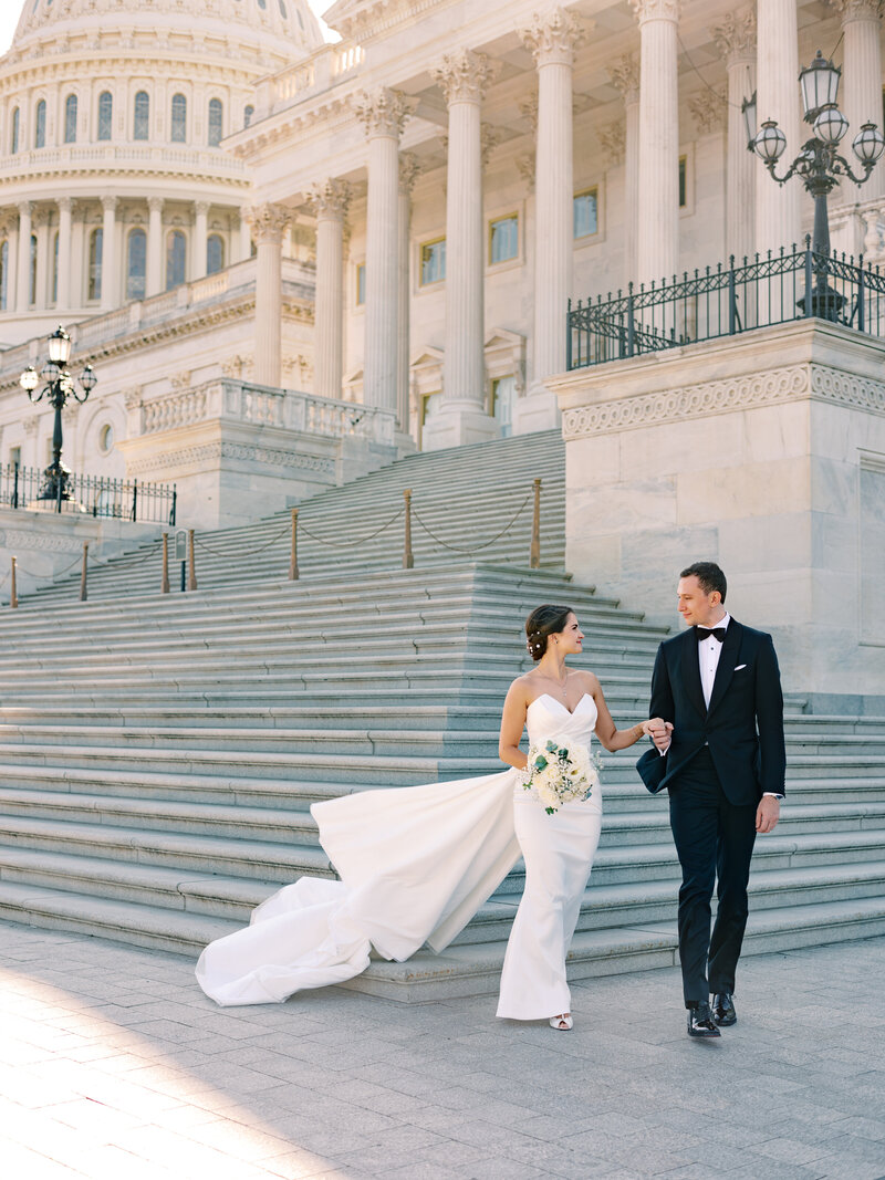 bride and groom walking on the rooftop of the international spy museum in washington dc wedding  photographer