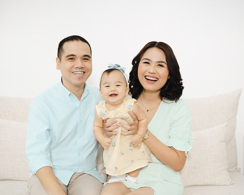 family of three smiling