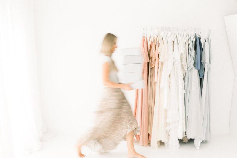 Woman blurs in frame infront of studio wardrobe in newport beach