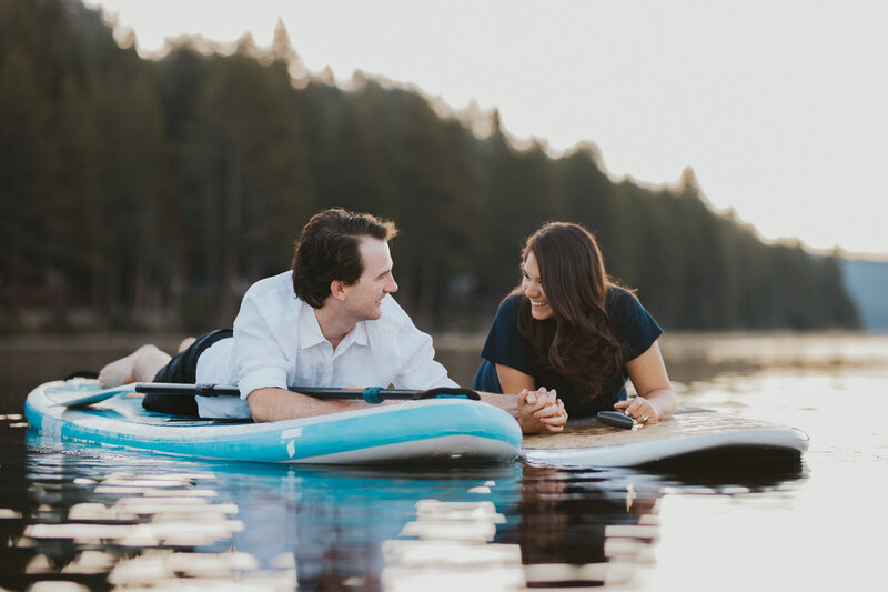 couples photoshoot on paddle boards in lake  tahoe