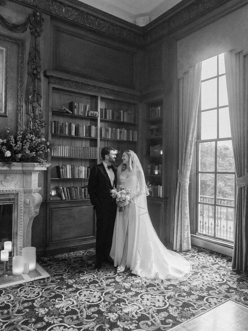 Bride and groom kiss outside New England venue