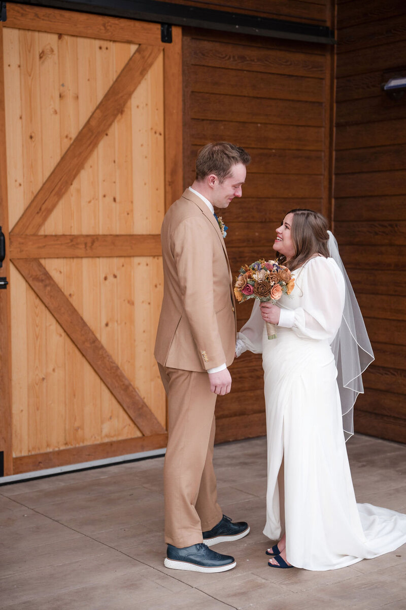 bride and groom ouside the barn at barnwood events in madison, winconsin