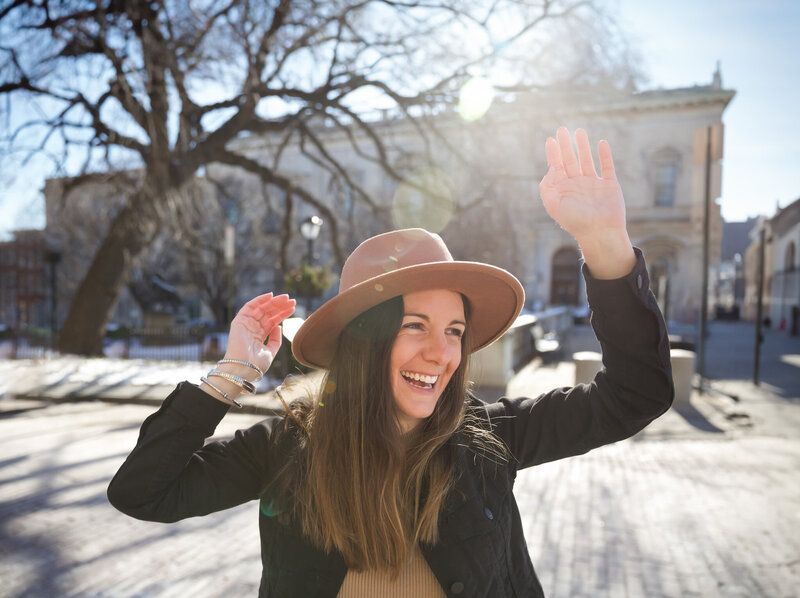 Ingrid Berrios, a Baltimore Branding photographer, took the photo of this young woman dancing in the street at Mount Vernon square in Baltimore, Maryland