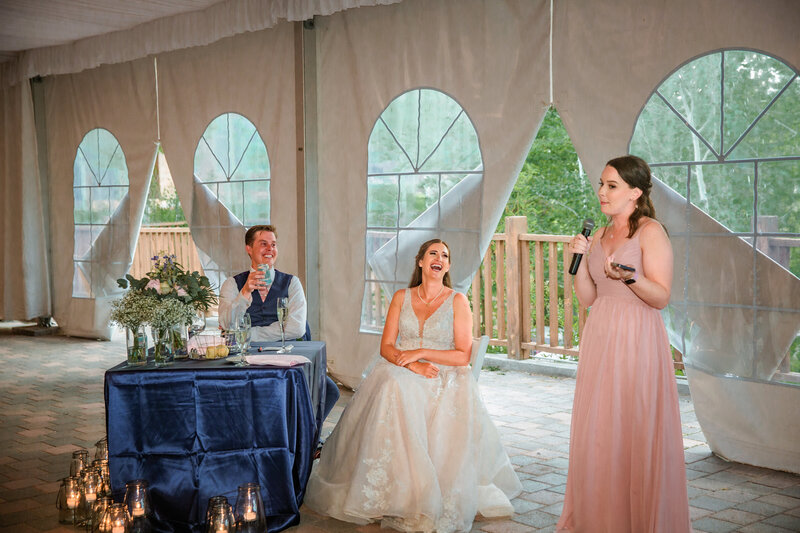 Jackson Hole photographers capture Grand Teton wedding with bridesmaid giving her reception speech
