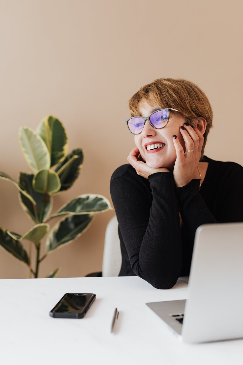Portrait of professional and entrepreneurial woman sitting at office desk