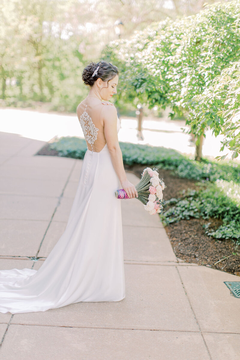 Edith Elan bride wearing in the Iset illusion back wedding dress for her Phoenixville Foundry wedding in Pennsylvania.