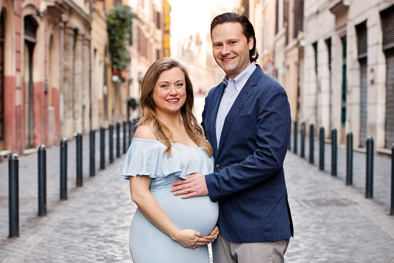 A couple on their babymoon on a classic roman street. Taken by Rome Photographer, Tricia Anne Photographer