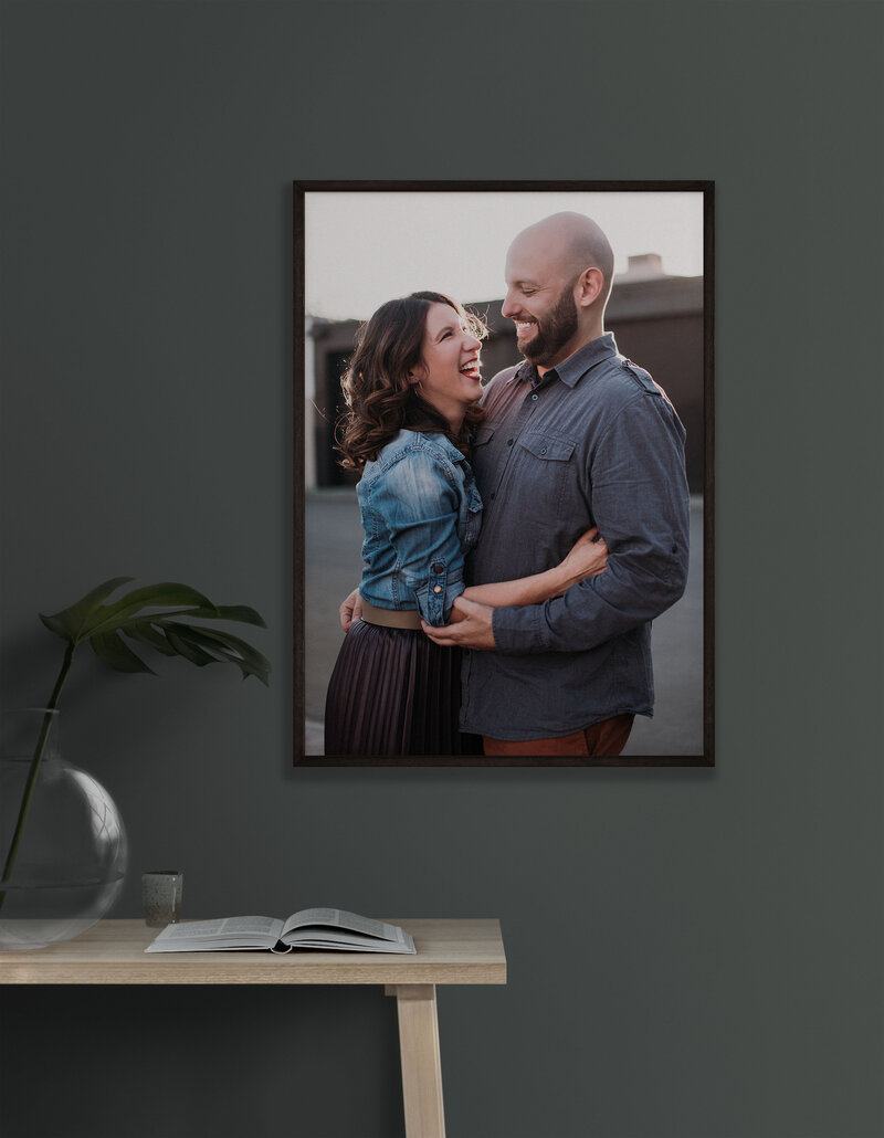 Framed photo of happy couple on green wall