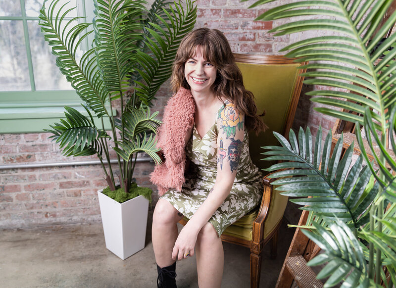 A-Baltimore-small-business-owner-smiles-and-laughs-while-taking-Brand-photos-with-Ingrid-Berrios-in-Baltimore