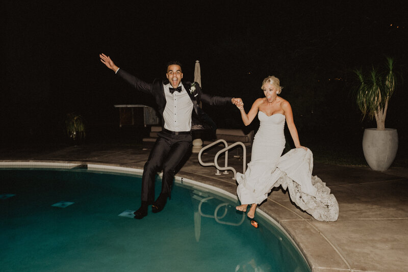 Bride and Groom jumping into swimming pool after a fun filled wedding reception at California venue, Park Winters