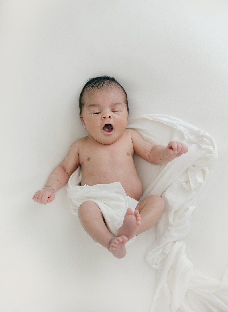 Newborn baby yawning by New Jersey baby photographer