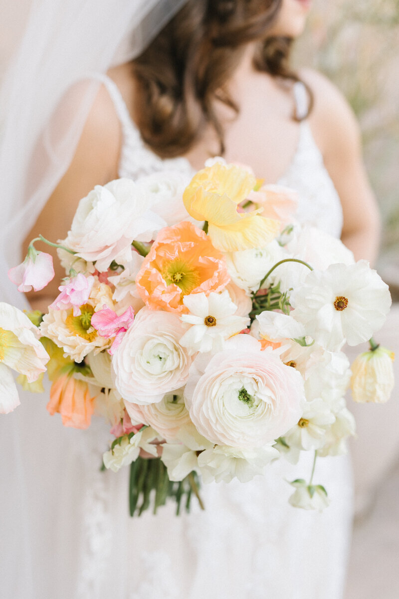 Bride with colorful floral bouquet