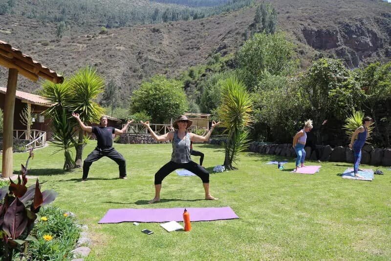 forest grass yoga pose yoga teacher training peru