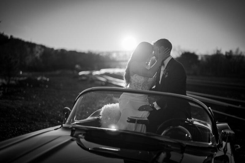 BRIDE AND GROOM ON TOP OF CAR AT THE BASILICA IN HUDSON