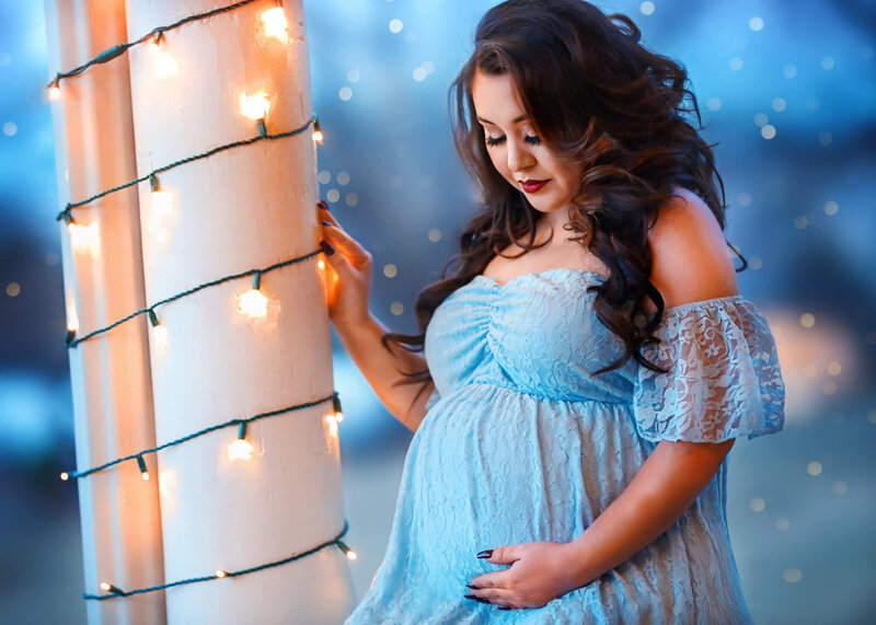 Pregnant momma posing in lacey blue dress at her H&N Photography denver photo session