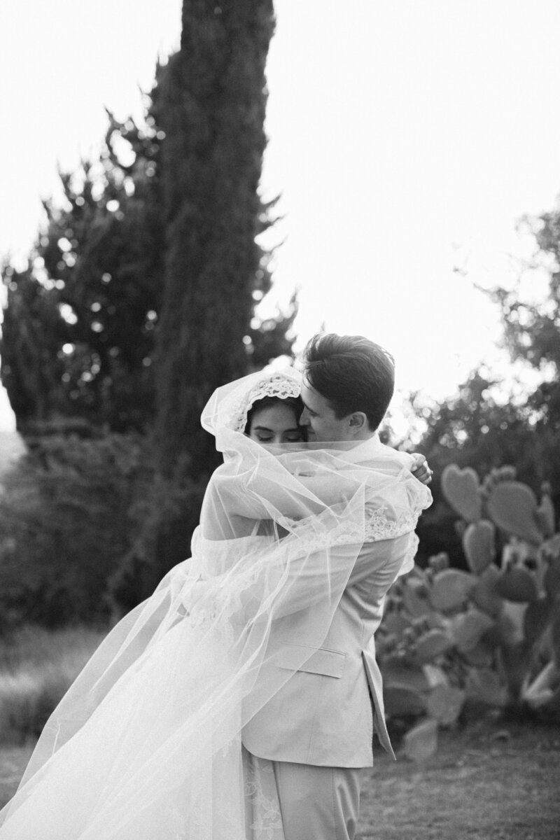 bride and groom hugging after their destination wedding ceremony