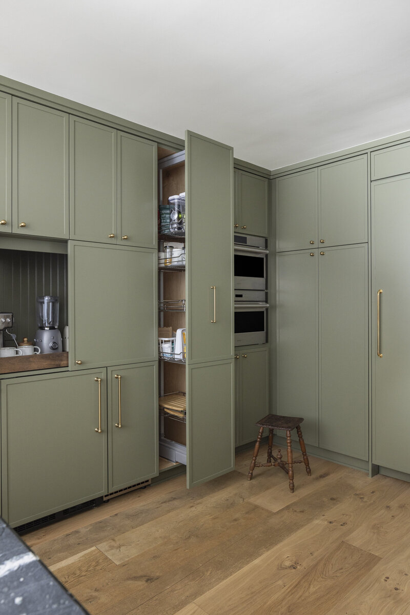 green skinny shaker kitchen cabinets with  a  pull out pantry