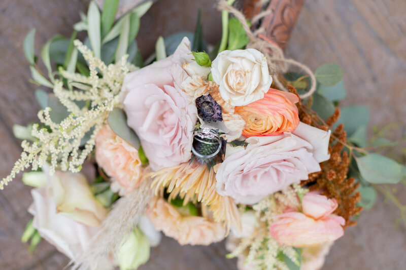 Washington Elopement Photographer captures bridal bouquet with wedding rings