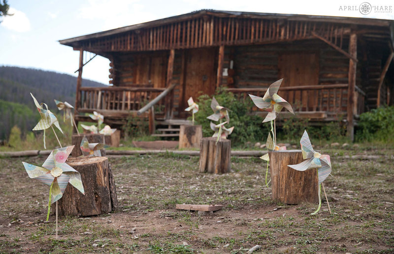 Pinwheels decorate aisle for outdoor wedding at the Rowley Homestead site at Snow Mountain Ranch in Winter Park